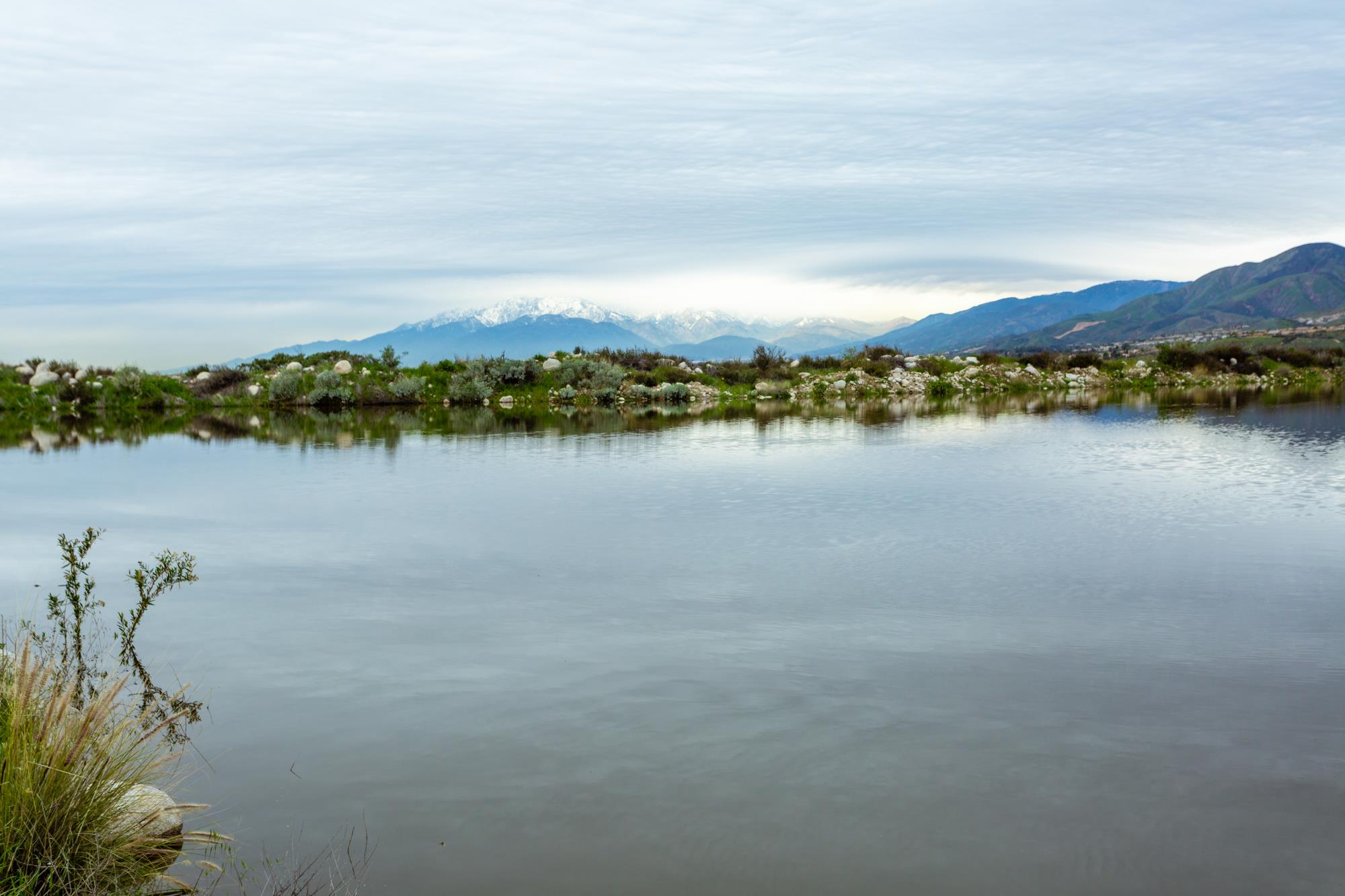 Pond with mountains in background